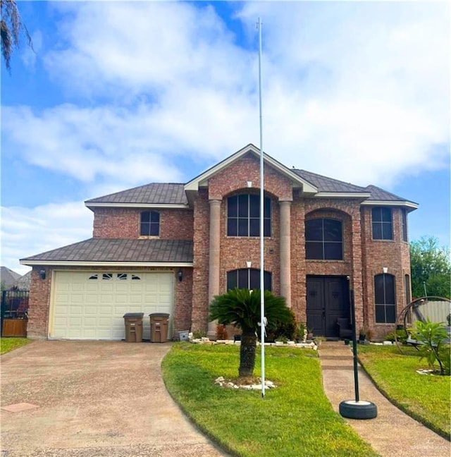 view of front facade with a garage and a front lawn