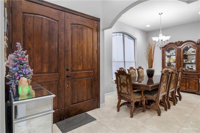 dining space with a notable chandelier