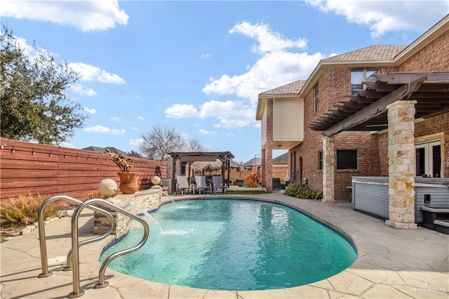 view of swimming pool featuring pool water feature, a hot tub, a pergola, and a patio area