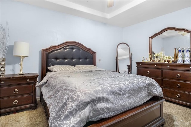 bedroom featuring dark colored carpet and ceiling fan