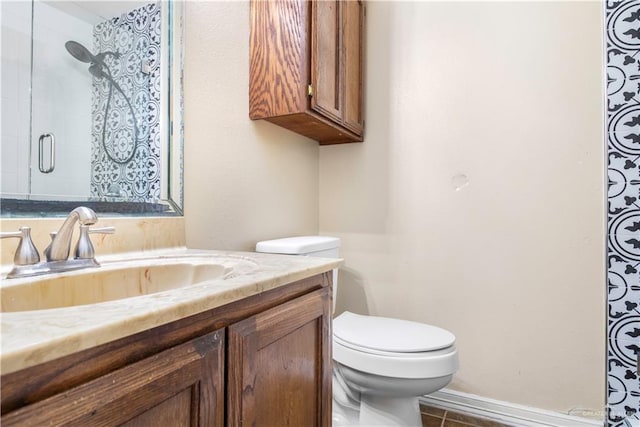 bathroom with walk in shower, vanity, and toilet