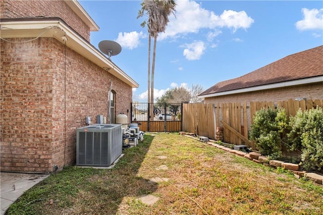 view of yard with central AC unit