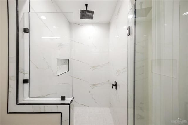 bathroom with a tile shower