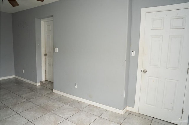 16877 Borchardt St, Harlingen, TX 78552 - spare room featuring ceiling fan, light tile patterned floors, and baseboards