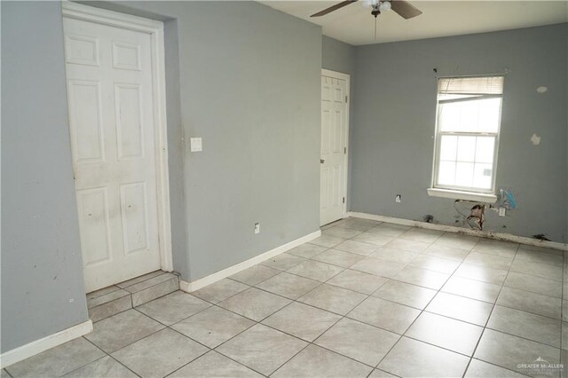 16877 Borchardt St, Harlingen, TX 78552 - empty room with ceiling fan, light tile patterned flooring, and baseboards