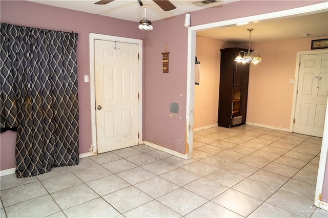 16877 Borchardt St, Harlingen, TX 78552 - spare room featuring a ceiling fan, light tile patterned floors, and baseboards