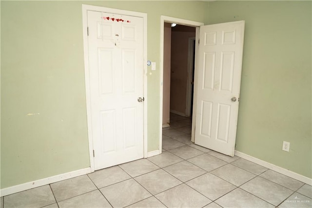 16877 Borchardt St, Harlingen, TX 78552 - unfurnished bedroom featuring light tile patterned floors and baseboards