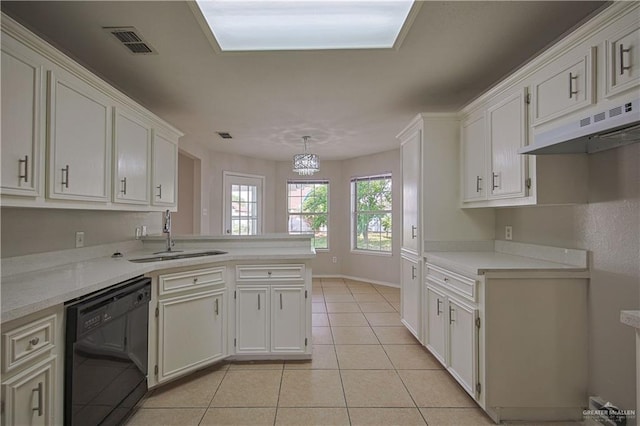 kitchen featuring pendant lighting, sink, black dishwasher, white cabinets, and light tile patterned flooring