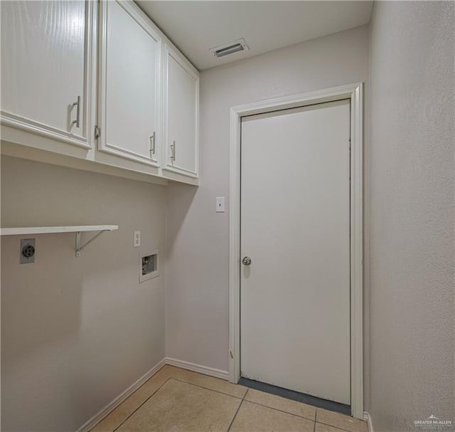 laundry area featuring cabinets, hookup for an electric dryer, hookup for a washing machine, and light tile patterned floors