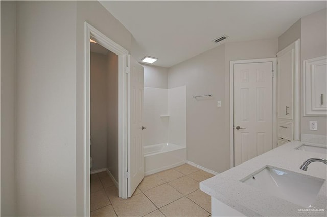 bathroom featuring tile patterned flooring, vanity, and shower / bathing tub combination