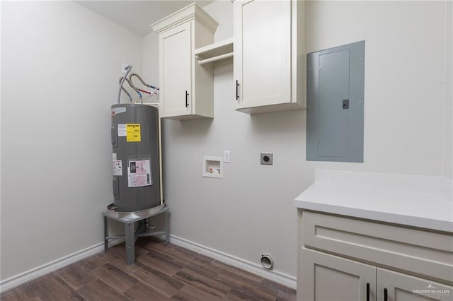 washroom featuring dark wood-type flooring, electric panel, electric water heater, cabinet space, and hookup for an electric dryer