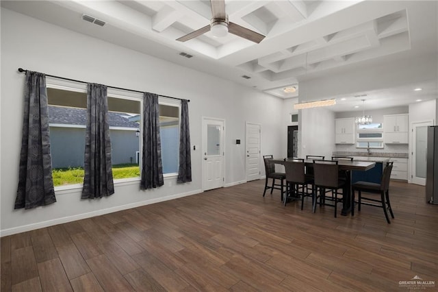 1421 Franklin Ave, Alton, TX 78573 - dining area with coffered ceiling, a ceiling fan, dark wood-style flooring, a chandelier, and a high ceiling