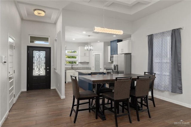 1421 Franklin Ave, Alton, TX 78573 - dining area featuring dark wood-type flooring, a chandelier, baseboards, and recessed lighting