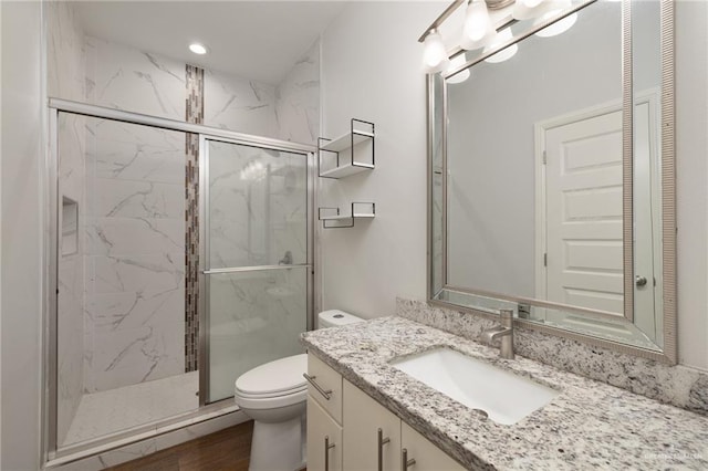 1421 Franklin Ave, Alton, TX 78573 - bathroom featuring a marble finish shower, toilet, vanity, and recessed lighting