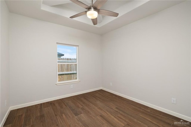1421 Franklin Ave, Alton, TX 78573 - unfurnished room with dark wood-style floors, a ceiling fan, baseboards, and a raised ceiling