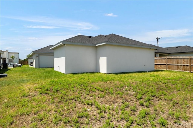 1421 Franklin Ave, Alton, TX 78573 - back of house featuring stucco siding