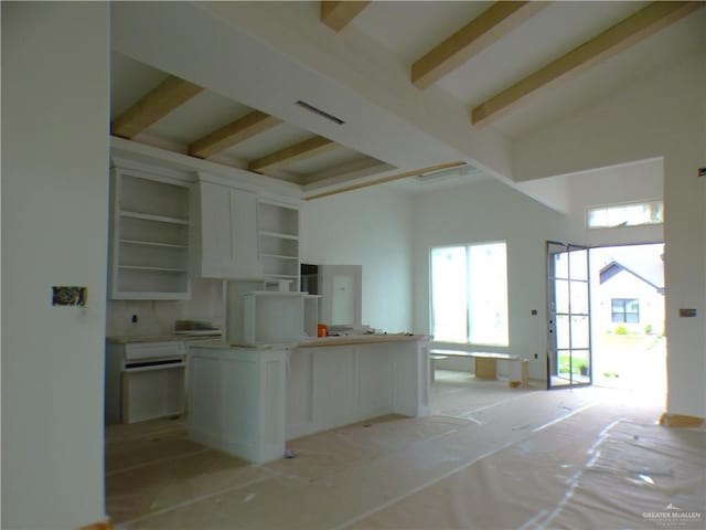 2701 E Versace Dr, Edinburg, TX 78542 - kitchen featuring a towering ceiling, open shelves, and beamed ceiling
