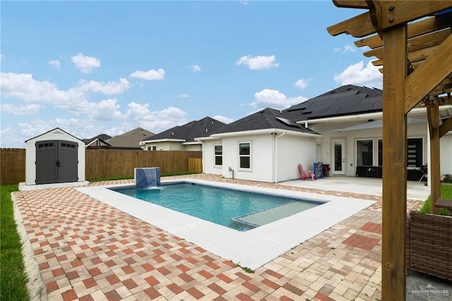 5904 N Dodger St, Pharr, TX 78577 - view of pool featuring a patio area, a storage unit, a fenced backyard, and an outdoor structure