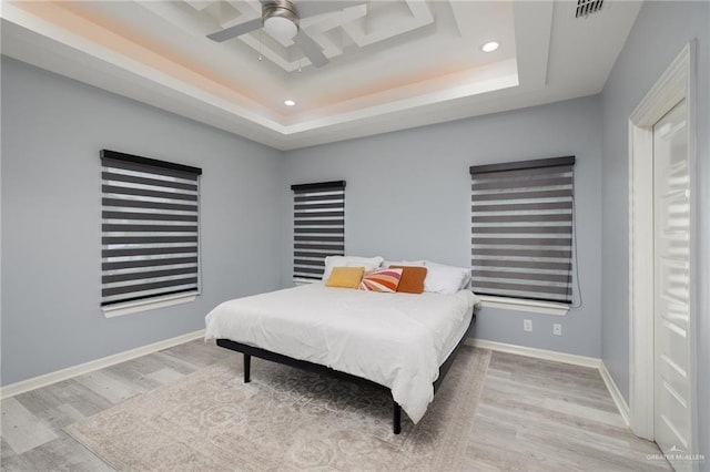 5904 N Dodger St, Pharr, TX 78577 - bedroom with a tray ceiling, wood finished floors, recessed lighting, ceiling fan, and baseboards