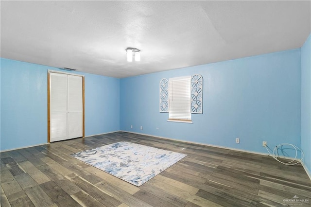 3204 Barbara Ln, Edinburg, TX 78542 - unfurnished bedroom featuring hardwood / wood-style floors, a closet, and baseboards