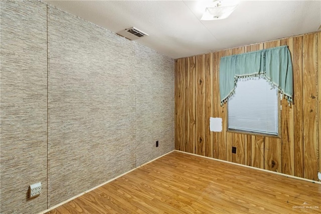 3204 Barbara Ln, Edinburg, TX 78542 - unfurnished room with wood finished floors and wood walls