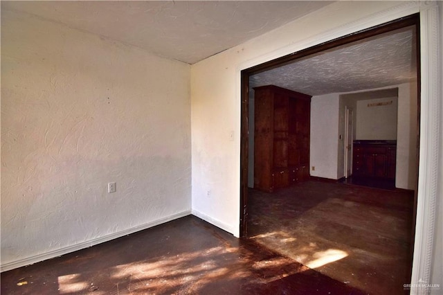 307 Bolivar Ave Unit 2, Rancho Viejo, TX 78575 - empty room with a textured ceiling
