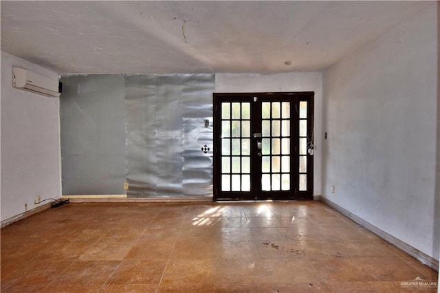 307 Bolivar Ave Unit 2, Rancho Viejo, TX 78575 - unfurnished room featuring french doors and a wall mounted air conditioner