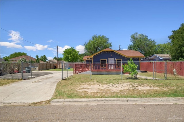 1301 Sonora St, Mission, TX 78572 - view of front of home with driveway, fence, and a gate