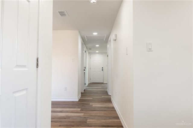 hall with dark hardwood / wood-style flooring