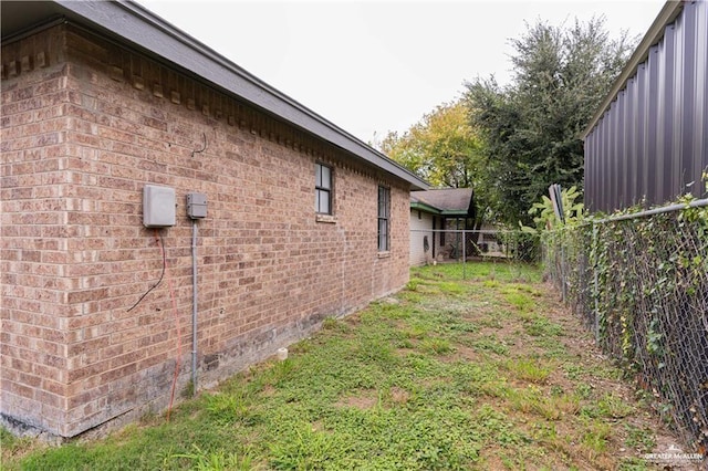 117 Keystone St, Mission, TX 78572 - view of property exterior with fence and brick siding