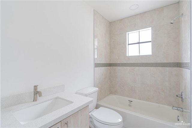 117 Keystone St, Mission, TX 78572 - bathroom featuring toilet, vanity, and tub / shower combination