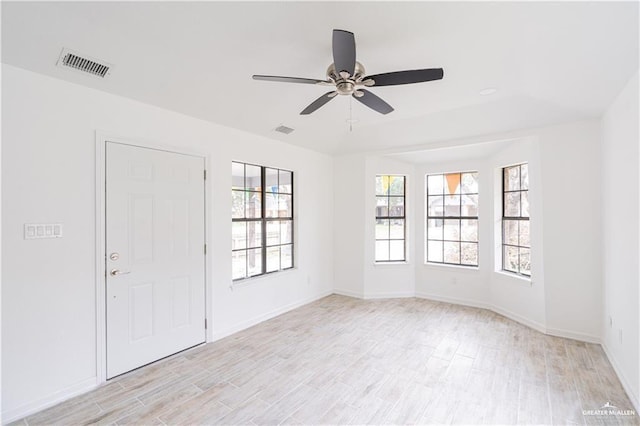 117 Keystone St, Mission, TX 78572 - unfurnished room with ceiling fan, plenty of natural light, and light wood-style flooring