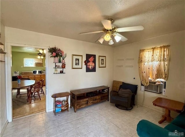 711 Marcos Hinojosa Ave, Hebbronville, TX 78361 - living area featuring ceiling fan, a textured ceiling, light tile patterned flooring, and cooling unit
