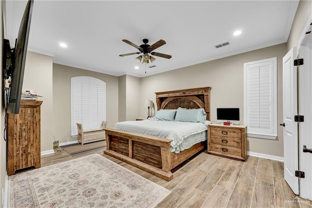 bedroom with light hardwood / wood-style flooring and ceiling fan