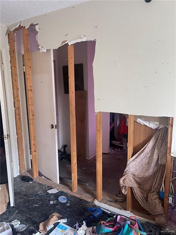 miscellaneous room featuring a textured ceiling