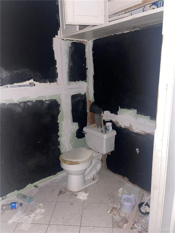 bathroom with tile patterned floors and toilet