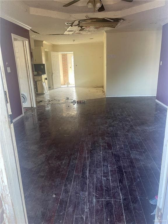 unfurnished room with ceiling fan and wood-type flooring