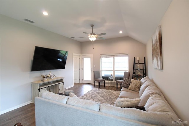 living room with ceiling fan, dark hardwood / wood-style flooring, and vaulted ceiling