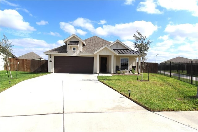 view of front of property with a garage and a front lawn