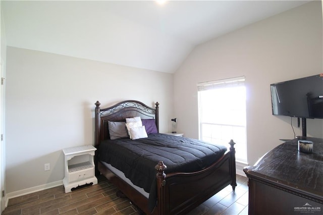 bedroom with lofted ceiling