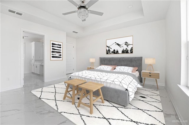 2620 Stevia Dr, Weslaco, TX 78596 - bedroom with marble finish floor, baseboards, visible vents, and a raised ceiling