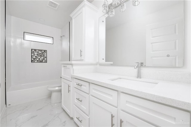 2620 Stevia Dr, Weslaco, TX 78596 - bathroom featuring vanity, marble finish floor, shower / washtub combination, toilet, and visible vents