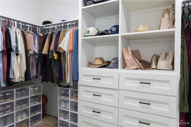 walk in closet featuring tile patterned flooring