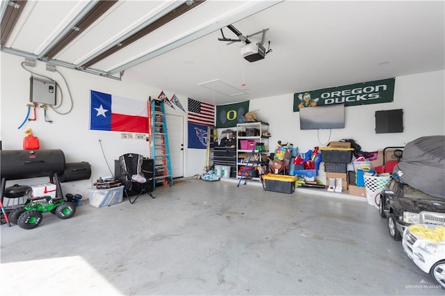 garage featuring a garage door opener