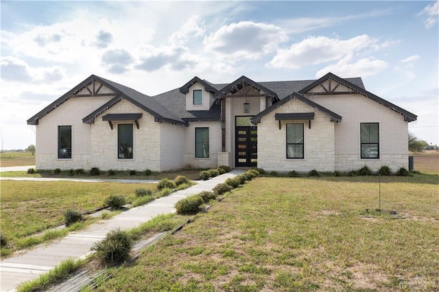 view of front of home with a front lawn