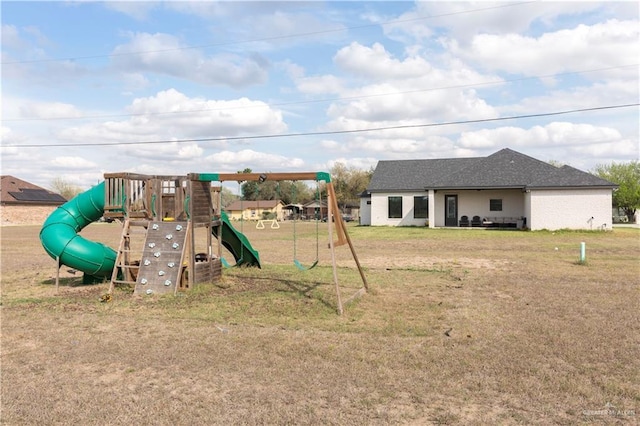 view of playground featuring a lawn