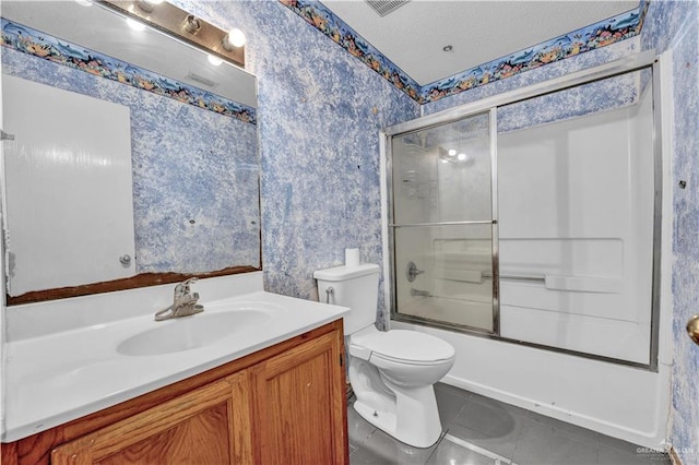 1101 Boston St, Edinburg, TX 78541 - bathroom with wallpapered walls, vanity, tile patterned flooring, and enclosed tub / shower combo
