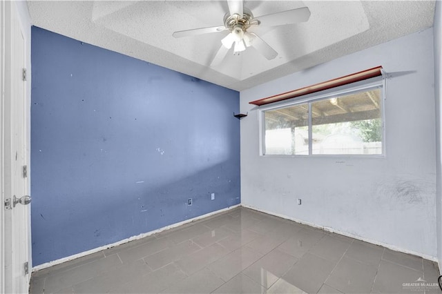 1101 Boston St, Edinburg, TX 78541 - empty room with a textured ceiling, a ceiling fan, and baseboards
