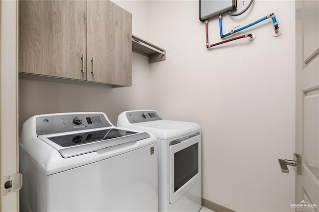 3302 S Sugar Rd Unit E, Edinburg, TX 78539 - laundry room with washing machine and dryer and cabinet space
