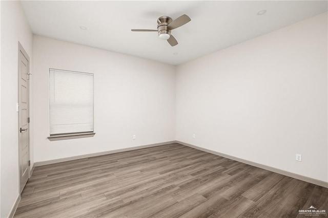 3302 S Sugar Rd Unit E, Edinburg, TX 78539 - unfurnished room featuring light wood-style flooring, ceiling fan, and baseboards